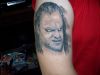 undertaker picture tattoo on arm